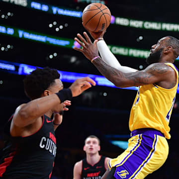 Jan 3, 2024; Los Angeles, California, USA; Los Angeles Lakers forward LeBron James (23) moves to the basket against the Miami Heat during the second half at Crypto.com Arena. Mandatory Credit: Gary A. Vasquez-Imagn Images