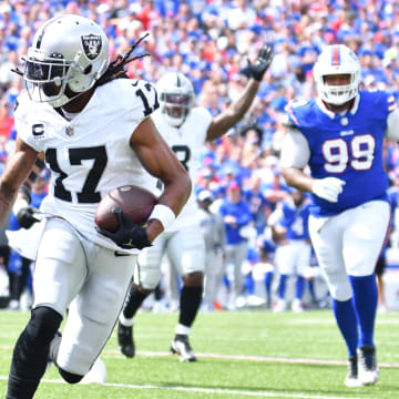 Sep 17, 2023; Orchard Park, New York, USA; Las Vegas Raiders wide receiver Davante Adams (17) runs for the end zone to score a touchdown in the first quarter against the Buffalo Bills at Highmark Stadium. Mandatory Credit: Mark Konezny-USA TODAY Sports