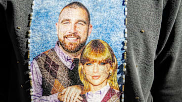 Miranda Jones, of Kentucky, poses for a photo in a sweatshirt she bedazzled as Taylor Swift fans take over Indianapolis before a show.