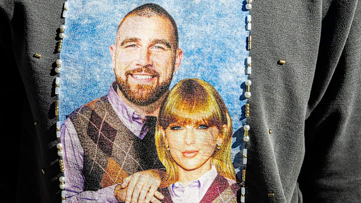 Miranda Jones, of Kentucky, poses for a photo in a sweatshirt she bedazzled as Taylor Swift fans take over Indianapolis before a show. Miranda Jones, of Kentucky, poses for a photo in a sweatshirt she bedazzled as Taylor Swift fans take over Indianapolis before a show.