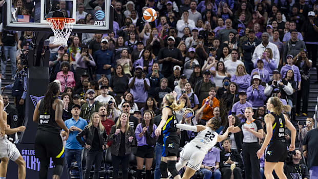 Golden State Valkyries guard Veronica Burton (22) shoots and scores after she is fouled by a Dallas Wings player