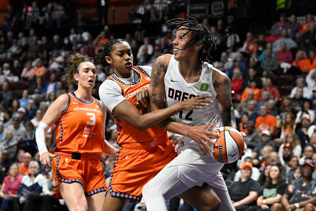 Atlanta Dream center Brittney Griner battles Connecticut Sun center Rayah Marshall. 