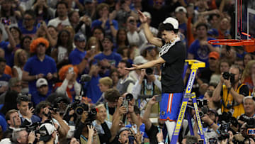 Apr 7, 2025; San Antonio, TX, USA; Florida Gators guard Walter Clayton Jr. (1) cuts the net after defeating the Houston Cougars in the national championship game of the Final Four of the 2025 NCAA Tournament at the Alamodome.Mandatory Credit: Scott Wachter-Imagn Images
