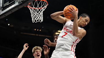 Mar 15, 2025; Kansas City, MO, USA; Houston Cougars guard Milos Uzan (7) grabs a rebound against the Arizona Wildcats during the second half for the Big 12 Conference Tournament Championship game at T-Mobile Center. Mandatory Credit: William Purnell-Imagn Images