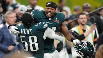 Feb 9, 2025; New Orleans, LA, USA; Philadelphia Eagles linebacker Jeremiah Trotter Jr. (54) reacts with linebacker Jalyx Hunt (58) after defeating the Kansas City Chiefs in Super Bowl LIX at Caesars Superdome. Mandatory Credit: Kirby Lee-Imagn Images