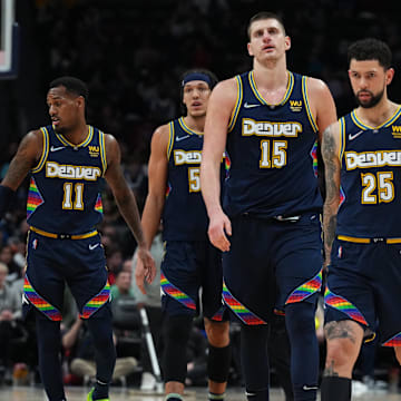 Denver Nuggets guard Austin Rivers (25) and center Nikola Jokic (15) and orward Aaron Gordon (50) and guard Monte Morris (11) during the fourth quarter at Ball Arena. 