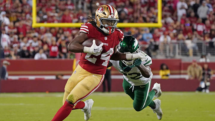 Sep 9, 2024; Santa Clara, California, USA; San Francisco 49ers running back Jordan Mason (24) rushes by New York Jets safety Tony Adams (22) in the fourth quarter at Levi's Stadium. Mandatory Credit: David Gonzales-Imagn Images