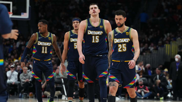 Mar 7, 2022; Denver, Colorado, USA; Denver Nuggets guard Austin Rivers (25) and center Nikola Jokic (15) and orward Aaron Gordon (50) and guard Monte Morris (11) during the fourth quarter at Ball Arena. Mandatory Credit: Ron Chenoy-USA TODAY Sports