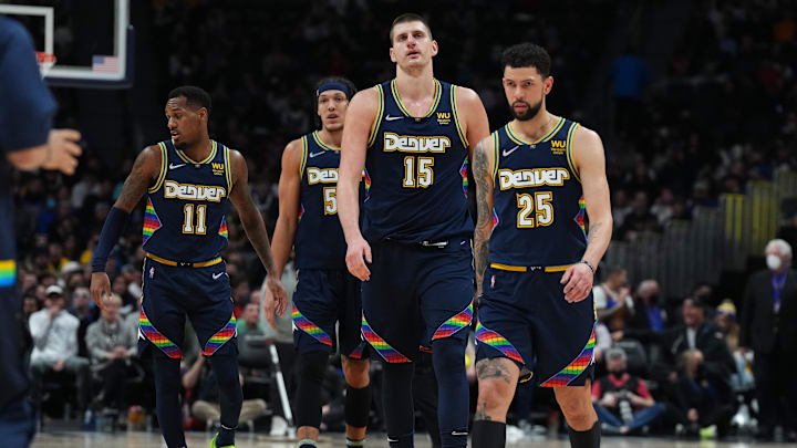 Denver Nuggets guard Austin Rivers (25) and center Nikola Jokic (15) and orward Aaron Gordon (50) and guard Monte Morris (11) during the fourth quarter at Ball Arena. 