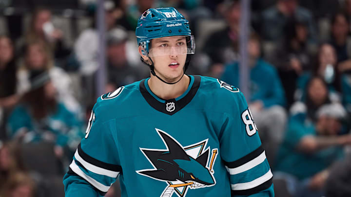 Dec 18, 2025; San Jose, California, USA; San Jose Sharks defenseman Shakir Mukhamadullin (85) looks on against the Dallas Stars during the third period at SAP Center at San Jose. Mandatory Credit: Robert Edwards-Imagn Images
