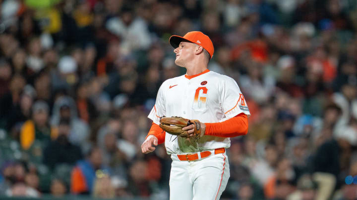 Jul 30, 2024; San Francisco, California, USA;  San Francisco Giants third baseman Matt Chapman (26) reacts after the error fielding a ground ball against the Oakland Athletics during the eighth inning at Oracle Park.