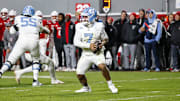 Nov 29, 2025; Raleigh, North Carolina, USA;  North Carolina Tar Heels quarterback Gio Lopez (7) runs with the football during the first half of the game against NC State Wolfpack at Carter-Finley Stadium.  Mandatory Credit: Jaylynn Nash-Imagn Images