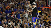 Apr 7, 2025; San Antonio, TX, USA; Florida Gators guard Walter Clayton Jr. (1) cuts the net after defeating the Houston Cougars in the national championship game of the Final Four of the 2025 NCAA Tournament at the Alamodome.