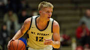 Mt. Vernon guard Luke Ertel rushes up the court during the game at New Castle Fieldhouse