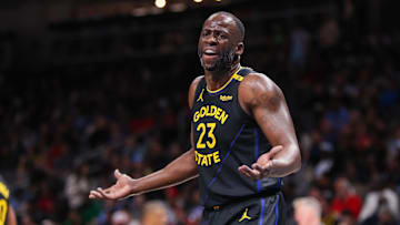 Golden State Warriors forward Draymond Green (23) argues a call against the Atlanta Hawks in the first quarter at State Farm Arena. 