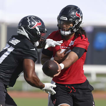 Jul 24, 2025; Houston, TX, USA; Houston Texans quarterback C.J. Stroud (7) and running back Nick Chubb (21) during training camp at Houston Methodist Training Center. Mandatory Credit: Troy Taormina-Imagn Images