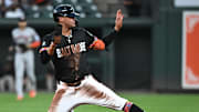 Aug 22, 2025; Baltimore, Maryland, USA;  Baltimore Orioles third baseman Luis Vázquez (52) steals second base during the second inning against the Houston Astros at Oriole Park at Camden Yards. Mandatory Credit: James A. Pittman-Imagn Images