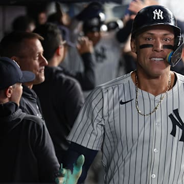 Sep 13, 2024; Bronx, New York, USA; New York Yankees center fielder Aaron Judge (99) celebrates in the dug out after hitting a grand slam home run during the seventh inning against the Boston Red Sox at Yankee Stadium. Mandatory Credit: Vincent Carchietta-Imagn Images