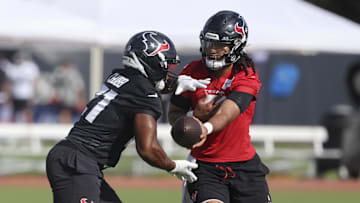 Jul 24, 2025; Houston, TX, USA; Houston Texans quarterback C.J. Stroud (7) and running back Nick Chubb (21) during training camp at Houston Methodist Training Center. Mandatory Credit: Troy Taormina-Imagn Images