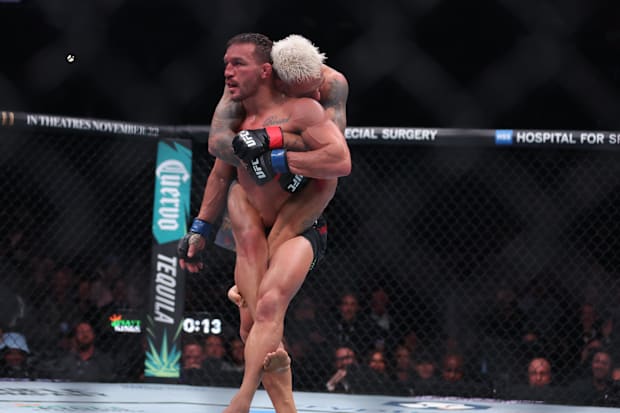Charles Oliveira fights Michael Chandler in the lightweight bout during UFC 309 at Madison Square Garden. 