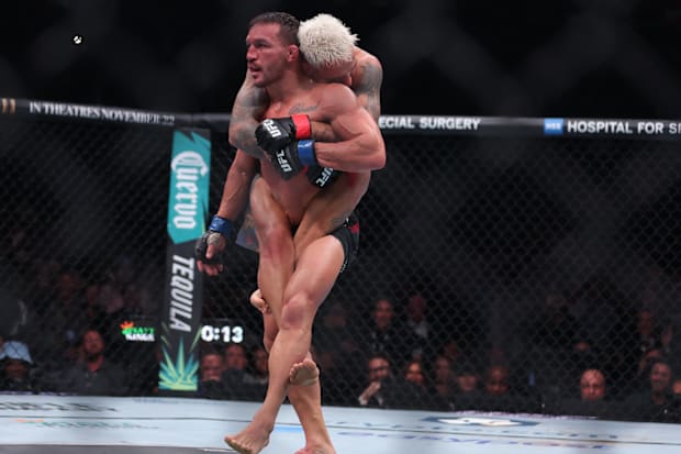 Charles Oliveira fights Michael Chandler in a lightweight bout during UFC 309 at Madison Square Garden. 