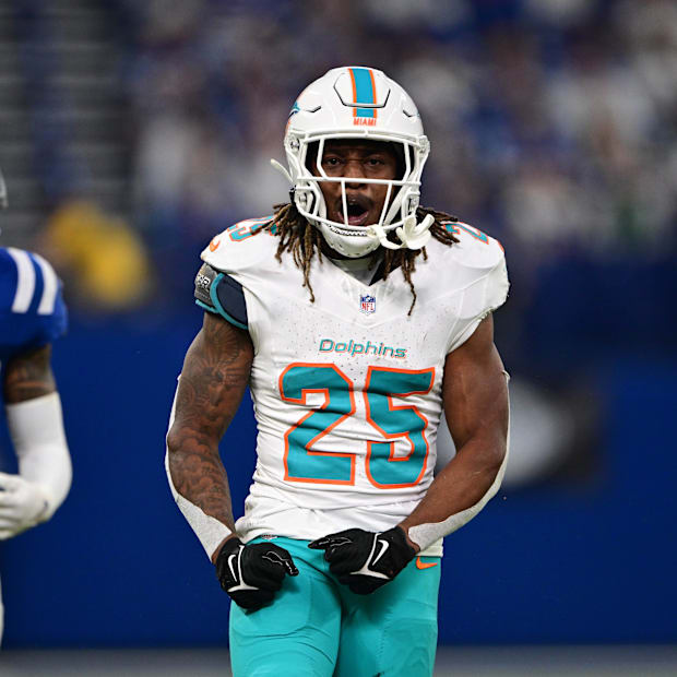 Miami Dolphins running back Jaylen Wright celebrates a long run in front of Indianapolis Colts safety Julian Blackmon.