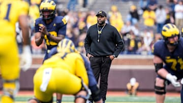 Michigan head coach Sherrone Moore watches a play behind quarterback Bryce Underwood (19) during the second half of the spring game at Michigan Stadium in Ann Arbor on Saturday, April 19, 2025.