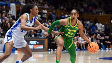 Mar 23, 2025; Durham, NC, USA; Oregon Ducks guard Deja Kelly (25) drives to the basket as Duke Blue Devils guard Reigan Richardson (24) defends during the second half at Cameron Indoor Stadium. The Blue Devils won 59-53. Mandatory Credit: Rob Kinnan-Imagn Images