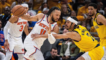 May 17, 2024; Indianapolis, Indiana, USA; New York Knicks guard Jalen Brunson (11) dribbles the ball while Indiana Pacers guard Andrew Nembhard (2) defends during game six of the second round for the 2024 NBA playoffs at Gainbridge Fieldhouse. Mandatory Credit: Trevor Ruszkowski-Imagn Images