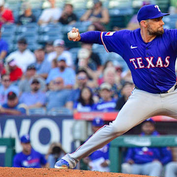 Jul 8, 2025; Anaheim, California, USA; Texas Rangers pitcher Nathan Eovaldi (17) throws against the Los Angeles Angels during the first inning at Angel Stadium. 