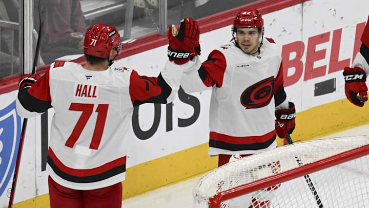 Apr 9, 2026; Chicago, Illinois, USA;  Carolina Hurricanes center Logan Stankoven (22) high fives left wing Taylor Hall (71) after he scores a goal against the Chicago Blackhawks during the second period at the United Center. Mandatory Credit: Matt Marton-Imagn Images