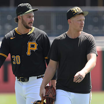 Aug 10, 2025; Pittsburgh, Pennsylvania, USA;  Pittsburgh Pirates pitchers Paul Skenes (30) and Mitch Keller (right) walk in from the bullpen before the game against the Cincinnati Reds at PNC Park. Mandatory Credit: Charles LeClaire-Imagn Images