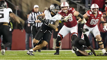 Nov 16, 2024; Madison, Wisconsin, USA;  Oregon Ducks linebacker Matayo Uiagalelei (10) intercepts a pass during the fourth quarter against the Wisconsin Badgers at Camp Randall Stadium. Mandatory Credit: Jeff Hanisch-Imagn Images
