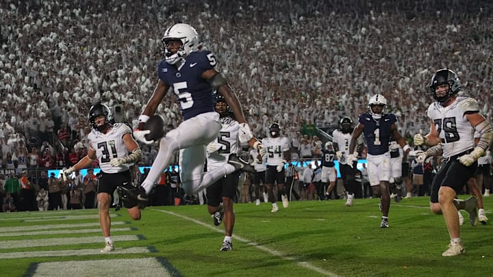 Penn State football wide receiver Devonte Ross (5) runs in for a touchdown during the fourth quarter against the Oregon Ducks at Beaver Stadium