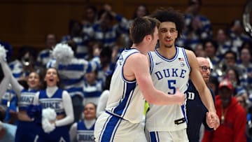 Jan 27, 2025; Durham, North Carolina, USA; Duke basketball forward Kon Knueppel (7) and guard Tyrese Proctor (5) react after a win against the North Carolina State Wolfpack at Cameron Indoor Stadium.  The Blue Devils won 74-64. 