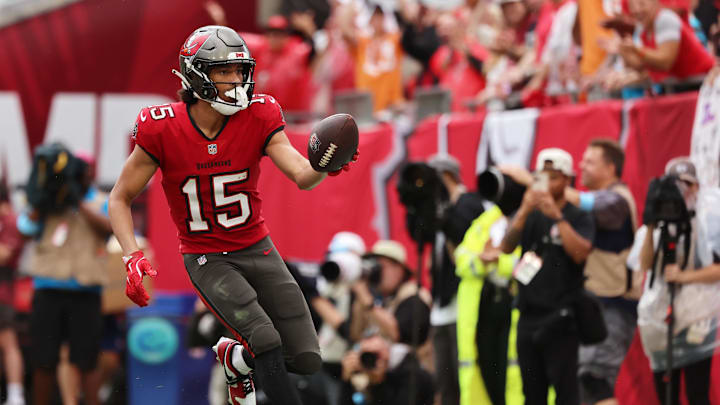 Dec 29, 2024; Tampa, Florida, USA; Tampa Bay Buccaneers wide receiver Jalen McMillan (15) scores a touchdown against the Carolina Panthers during the second half at Raymond James Stadium. Mandatory Credit: Kim Klement Neitzel-Imagn Images
