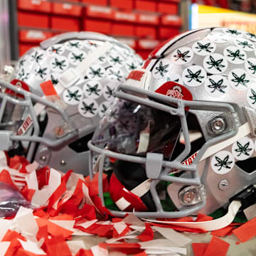 Jan 20, 2025; Atlanta, GA, USA; Detailed view of confetti with an Ohio State Buckeyes helmet after winning the CFP National Championship college football game at Mercedes-Benz Stadium. Mandatory Credit: Mark J. Rebilas-Imagn Images