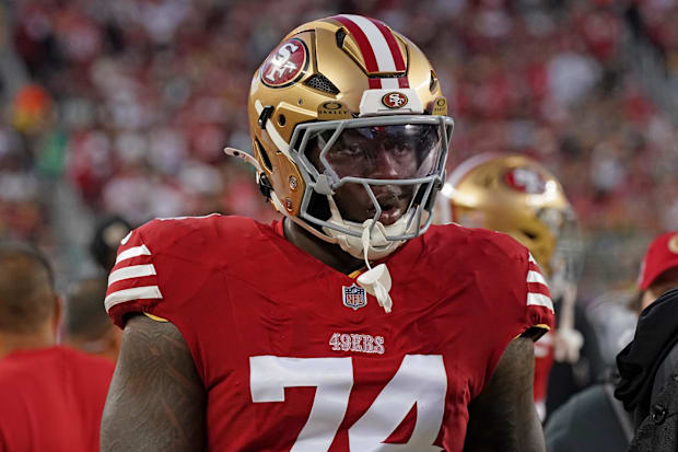 San Francisco 49ers offensive tackle Spencer Burford (74) watches the action from the sideline in the third quarter against t