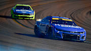 Nov 2, 2025; Avondale, Arizona, USA; NASCAR Cup Series driver Denny Hamlin (11) leads driver Ryan Blaney (12) during the Cup Series Championship race at Phoenix Raceway.