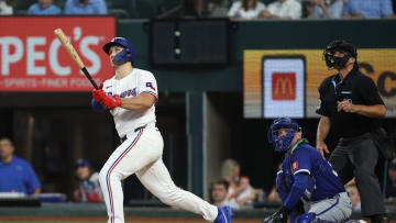 Jun 22, 2024; Arlington, Texas, USA; Texas Rangers left fielder Wyatt Langford (36) hits a grand slam home run in the eighth inning against the Kansas City Royals at Globe Life Field. Mandatory Credit: Tim Heitman-USA TODAY Sports