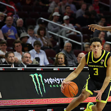 Feb 1, 2024; Los Angeles, California, USA; Oregon Ducks guard Jackson Shelstad (3) dribbles the ball against USC Trojans forward Joshua Morgan (24) during the second half at Galen Center. Mandatory Credit: Kiyoshi Mio-Imagn Images