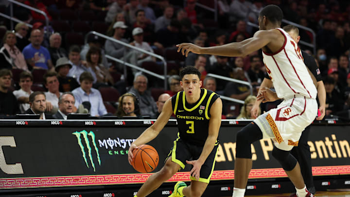 Feb 1, 2024; Los Angeles, California, USA; Oregon Ducks guard Jackson Shelstad (3) dribbles the ball against USC Trojans forward Joshua Morgan (24) during the second half at Galen Center. Mandatory Credit: Kiyoshi Mio-Imagn Images