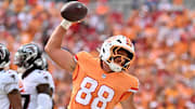Oct 27, 2024; Tampa, Florida, USA; Tampa Bay Buccaneers tight end Cade Otton (88) spikes the ball after scoring a touchdown in the first half  against the Atlanta Falcons at Raymond James Stadium. Mandatory Credit: Jonathan Dyer-Imagn Images
