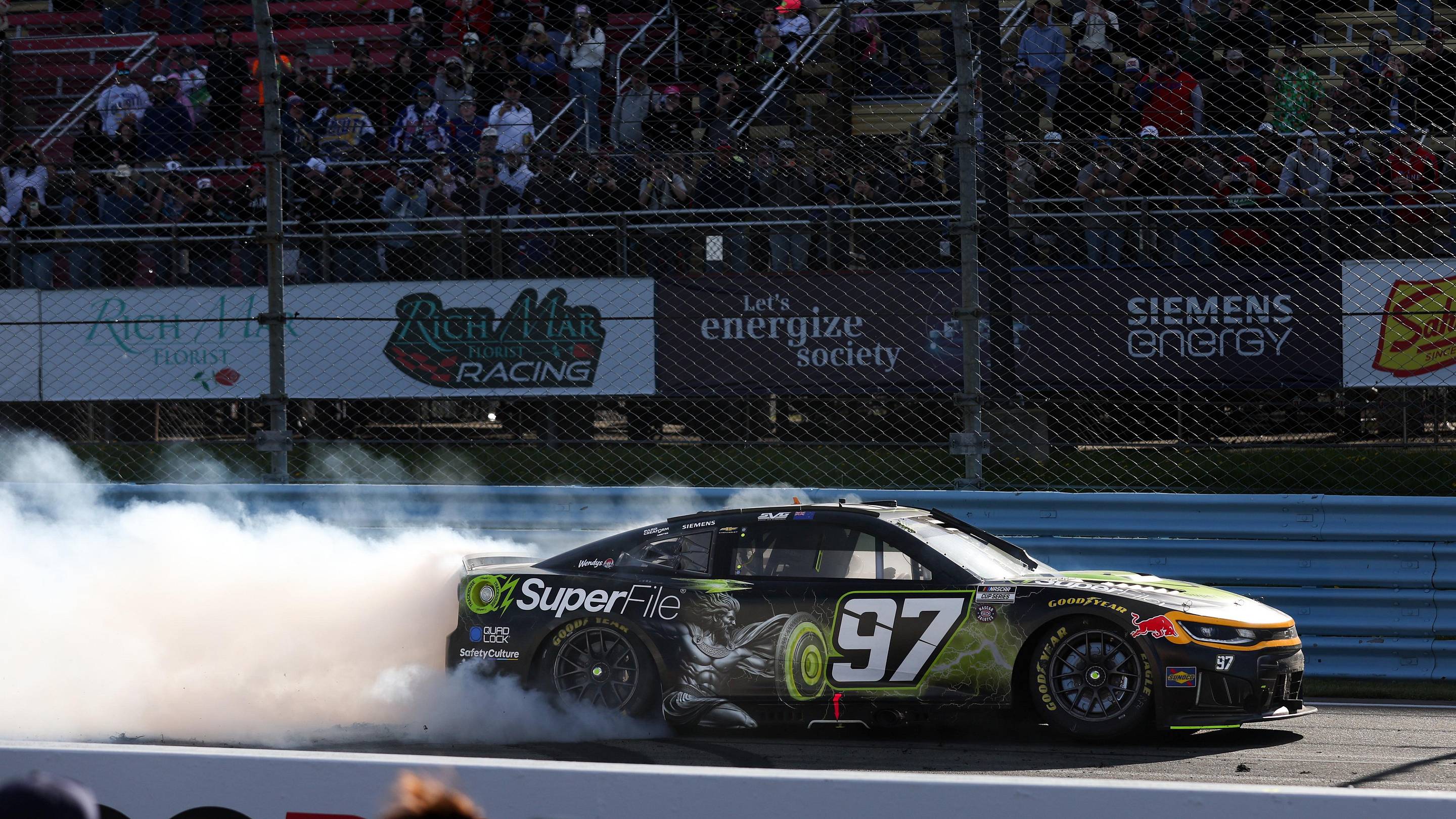 May 10, 2026; Watkins Glen, New York, USA; NASCAR Cup Series driver Shane Van Gisbergen (97) celebrates after winning the Go Bowling at The Glen at Watkins Glen International. Mandatory Credit: Matthew O’Haren-Imagn Images