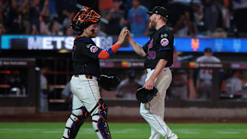 Jul 26, 2024; New York City, New York, USA;  New York Mets relief pitcher Jake Diekman (30) celebrates with catcher Francisco Alvarez (4) after the game against the Atlanta Braves at Citi Field. Mandatory Credit: Vincent Carchietta-Imagn Images