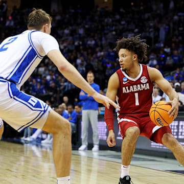 Mar 29, 2025; Newark, NJ, USA; Alabama Crimson Tide guard Mark Sears (1) handles the ball against Duke Blue Devils forward Cooper Flagg (2) during the second half in the East Regional final of the 2025 NCAA tournament at Prudential Center. Mandatory Credit: Vincent Carchietta-Imagn Images