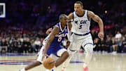 Oct 27, 2025; Philadelphia, Pennsylvania, USA; Philadelphia 76ers guard Tyrese Maxey (0) dribbles past Orlando Magic guard Desmond Bane (3) during the fourth quarter at Xfinity Mobile Arena. Mandatory Credit: Bill Streicher-Imagn Images