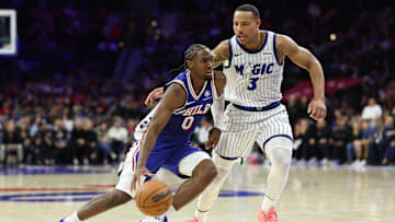 Oct 27, 2025; Philadelphia, Pennsylvania, USA; Philadelphia 76ers guard Tyrese Maxey (0) dribbles past Orlando Magic guard Desmond Bane (3) during the fourth quarter at Xfinity Mobile Arena. Mandatory Credit: Bill Streicher-Imagn Images