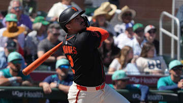 Mar 15, 2025; Scottsdale, Arizona, USA; San Francisco Giants shortstop Willy Adames (2) hits against the Seattle Mariners in the first inning at Scottsdale Stadium. 