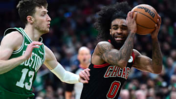 Jan 29, 2025; Boston, Massachusetts, USA; Chicago Bulls guard Coby White (0) controls the ball while Boston Celtics forward Drew Peterson (13) defends during the second half at TD Garden. Mandatory Credit: Bob DeChiara-Imagn Images